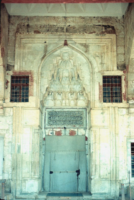 Muqarnas entry portal pierced with windows on the sides to illuminate the muezzin's platform on the interior