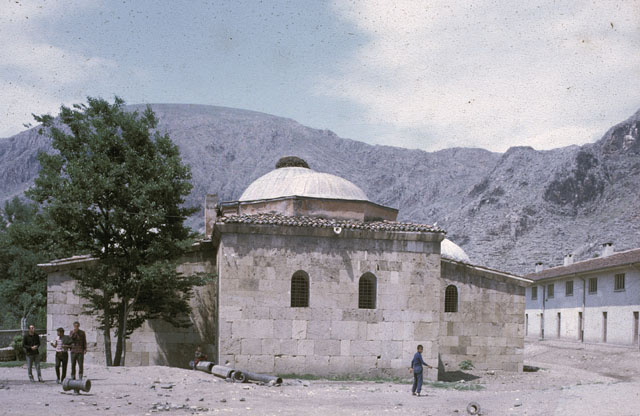 Exterior view from south showing the qibla wall of the southern iwan, with rooms flanking the central hall projecting on the sides