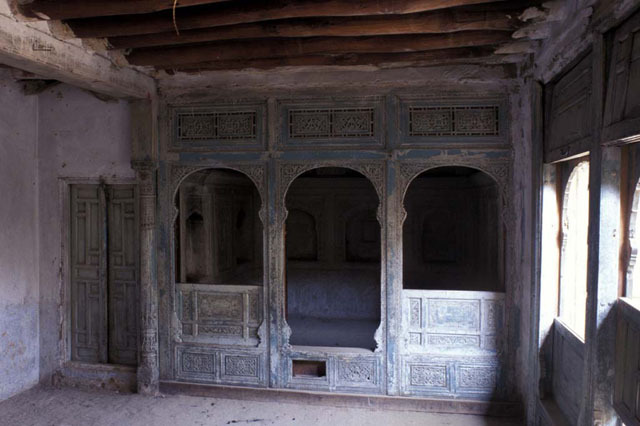 Internal decorated timber partition in winter room, south wing, prior to conservation