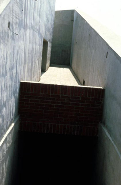 Exterior view, showing inclined concrete walls