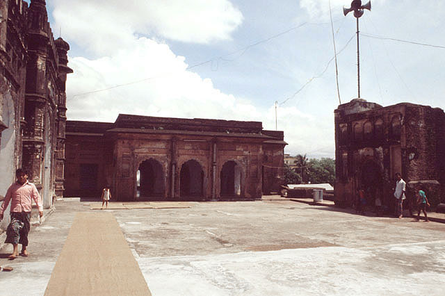 Madrasa with gateway to the right and mosque to the left