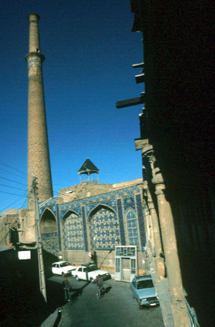 Exterior view, entrance portal and minaret from street.