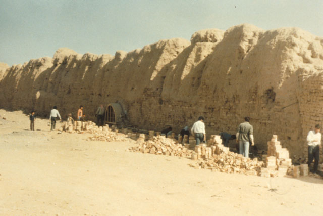 Exterior view showing work along wall