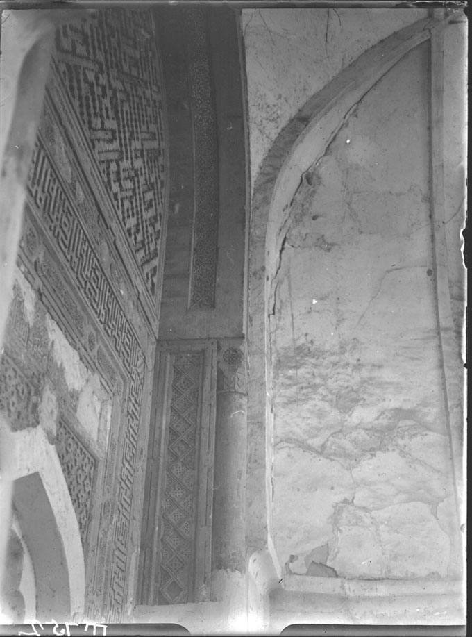 Terracotta panels inlaid in mihrab niche's archivolt