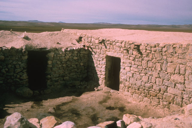 Exterior view showing sunken stone construction