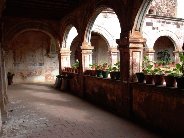 Interior view towards the courtyard and showing the arches of the portico