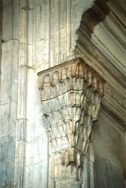 Detail from entry to mosque; the ogee arch of portal falls on crystalline marble capital of column flanking entrance