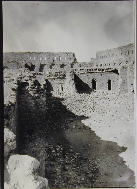 View from south-southwest, Three doorways opening into vanished riwaq and rear court in center, section of north and east enclosure wall in background