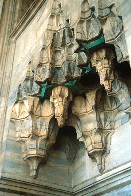 Exterior detail from northern façade of mosque; stalactite roof of marble mihrab niche