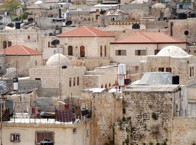 Dar al-Itam al-Islamiyya; general view across neighborhood rooftops showing restored domes