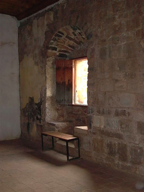 Interior view showing a window niche with built in seats on either side