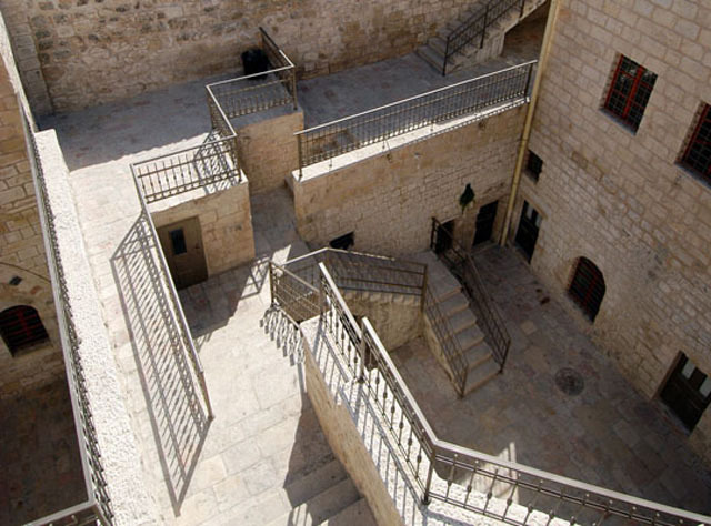 Dar al-Itam al-Islamiyya; view into first courtyard, after restoration, with staircase to upper levels