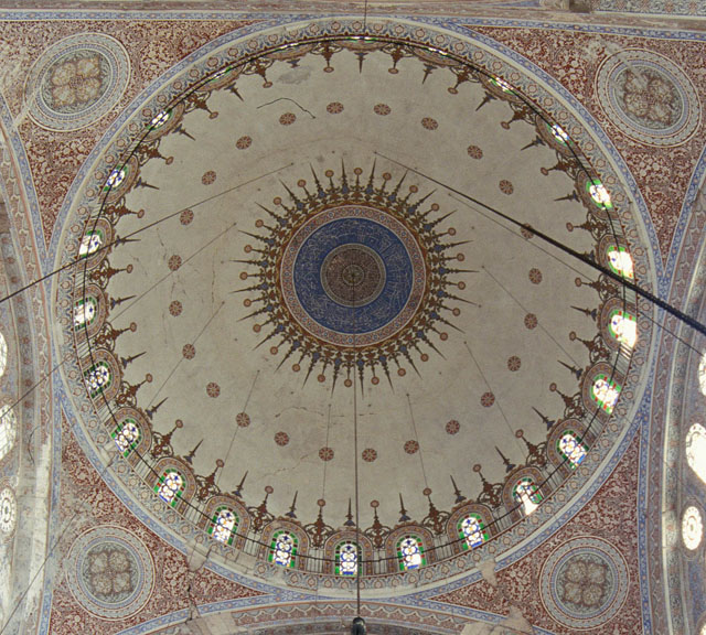 Interior view of dome showing concentric painted decoration with arabesque motifs