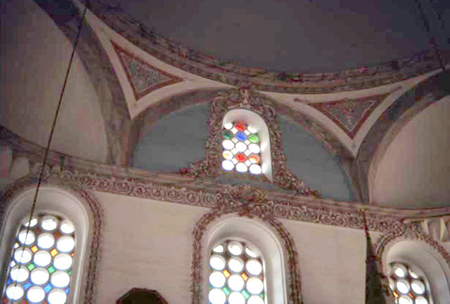 Interior detail; neo-baroque decoration around clerestory windows with colored glass