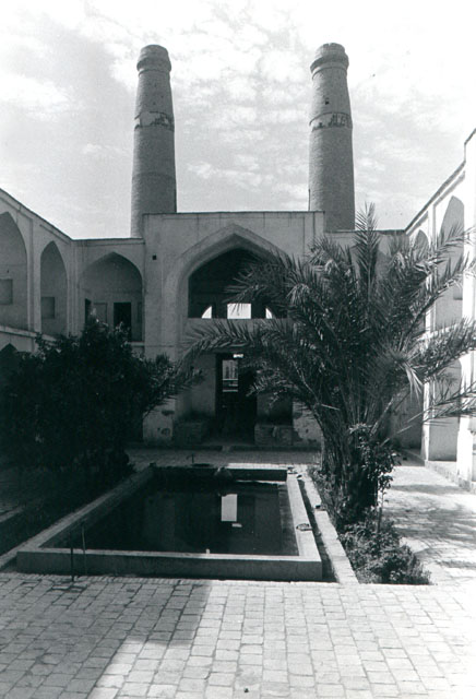 General view of courtyard, looking towards main portal, topped by minarets