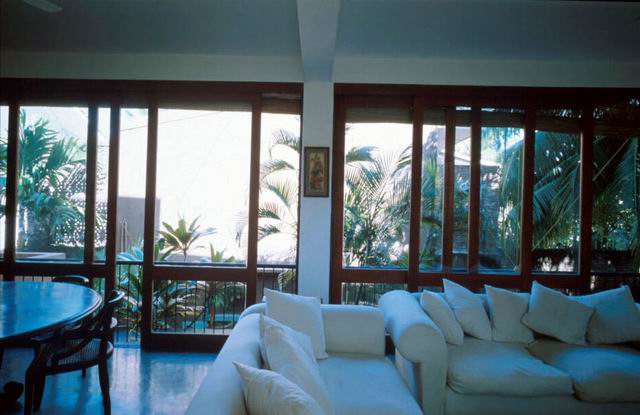 Interior detail showing view from living area through to gardens