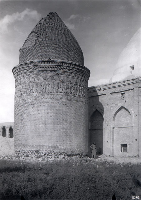 Exterior view, seen prior to restoration, with the wall of Khanaqah of Shah Rukh seen behind