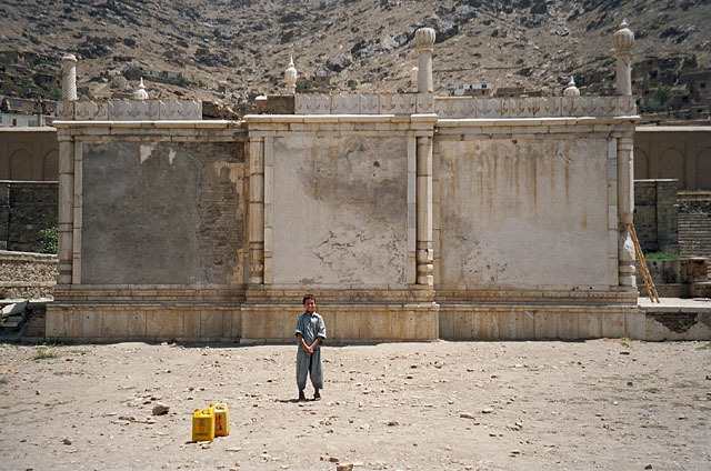 Exterior view from west, showing plastered qibla wall prior to restoration