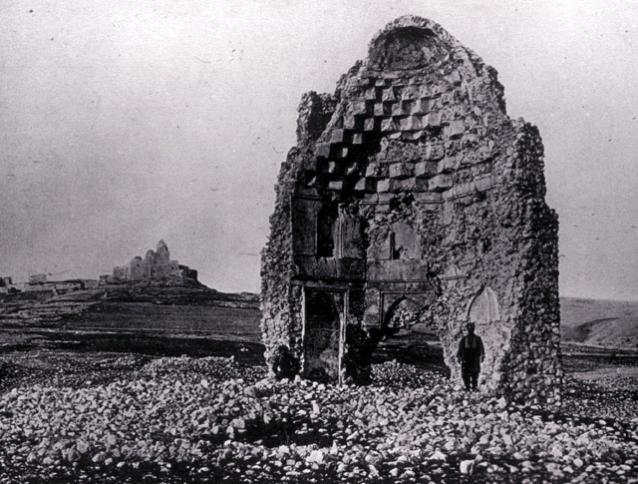 Full view of ruins showing the interior decorations and the muqarnas dome