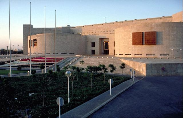 Façade, semicircular forms flanking the main entrance contain the library and diplomatic school