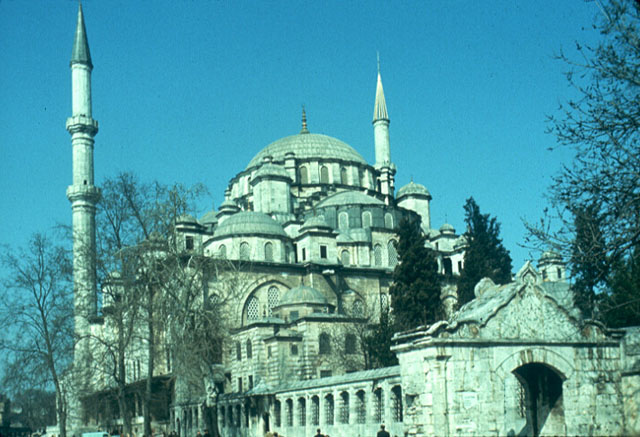 Exterior view of mosque from south. The Çorba or Soup Gate -the only one remaining of the four original gates to the precinct- is seen in the foreground