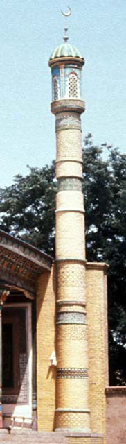 Altun Mosque - Engaged brick column of prayer hall with decorative horizontal bands and lantern-like finial