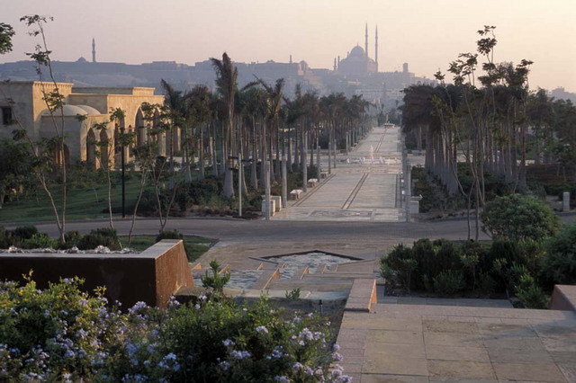 Al-Azhar Park - Central promenade, view looking south from the Hilltop Restaurant terrace past the eastern gate (left). Muhammad Ali Mosque (Citadel) appears in the background