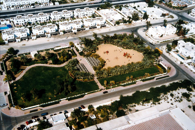 Aerial view showing housing development surrounding green space