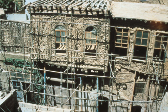 Elevated view showing façade with scaffolding