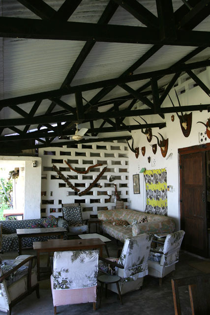 View of cottage verandah with showing truss supports of roof and perforated side wall