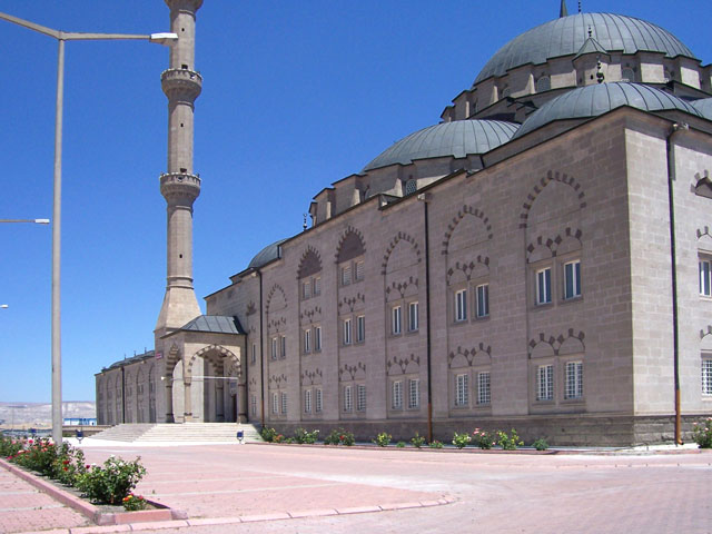 Exterior view from southwest, showing side entrance to prayer hall