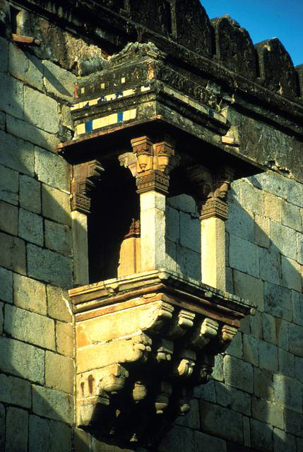 Exterior close-up of bay window supported by corbels on south façade
