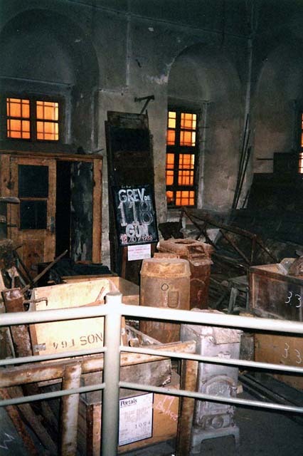 Interior view of room used as depot, before restoration