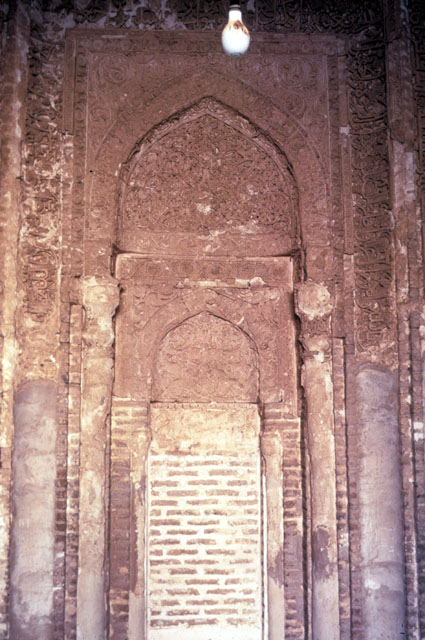 View of mihrab with framing bands of inscription