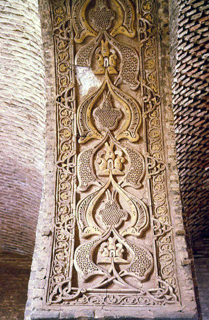 View of stucco decoration on intrado of arch between two vaulted spaces