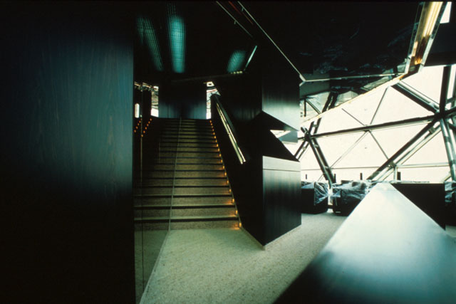 Interior view showing lit staircase and dramatic view