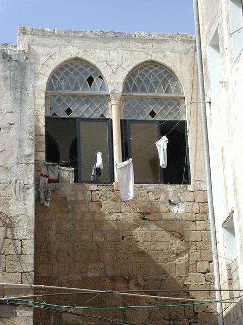 Twin windows facing the courtyard above main entrance