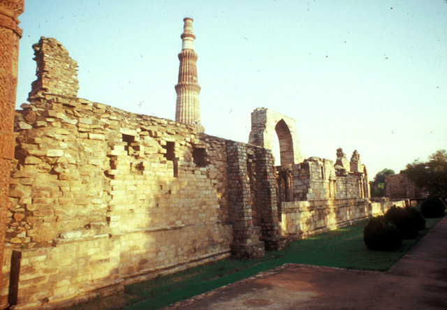 View from the northwest end of the complex showing the qibla wall and Qutb Minar