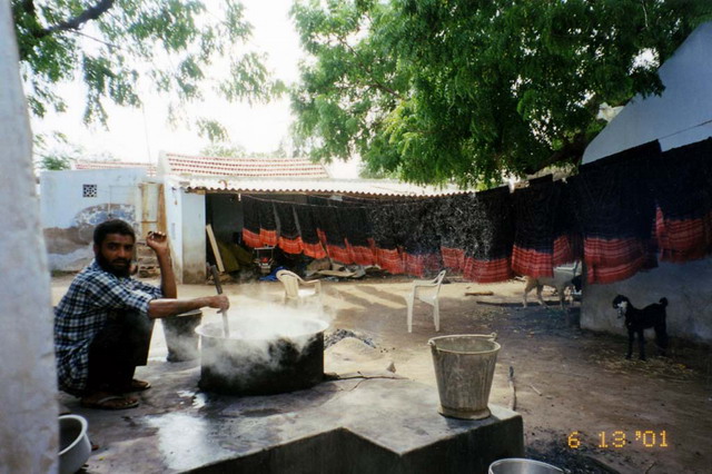 Man cooking in the courtyard