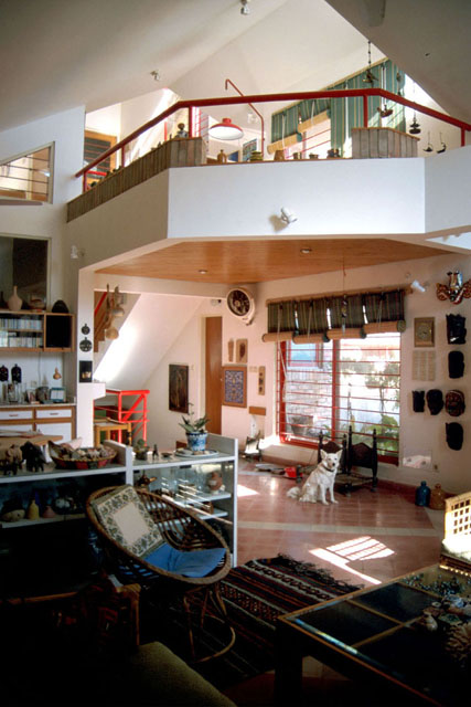 Interior view showing two-story main room and balcony