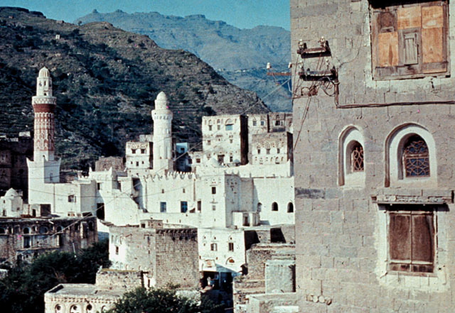 Close-up of mosque with terraced hillside in the background