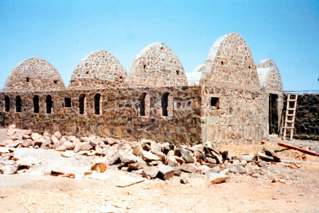 A stone house under construction