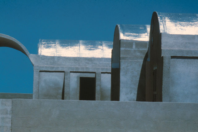 Exterior view showing poured concrete structure before white-wash is applied