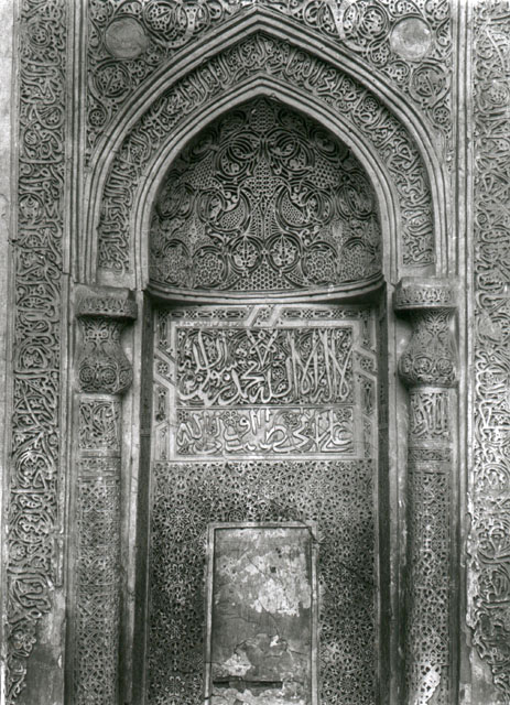 Interior view, keel-arched mihrab with carved stucco ornament of the Friday Mosque of Bastam