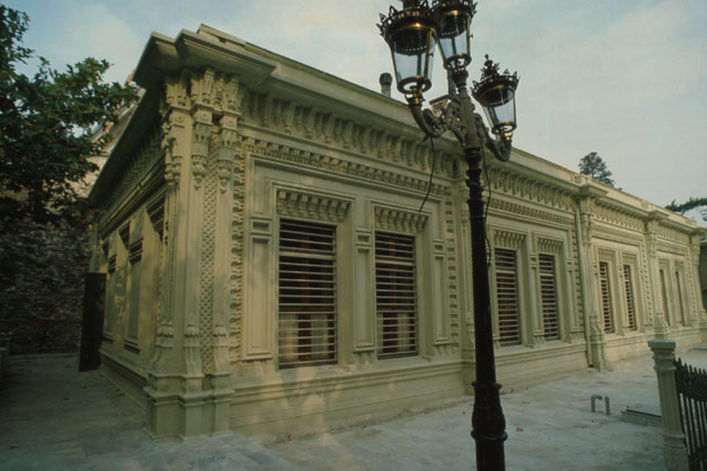 Exterior detail showing baroque carving and iron work of street lamps