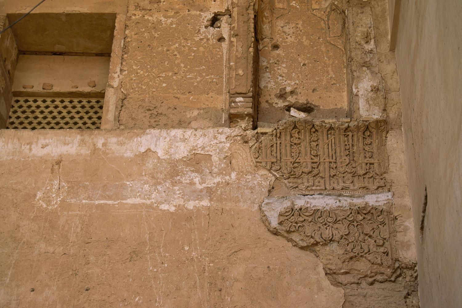 Detail of the back wall of the iwan, with carved stucco fragments