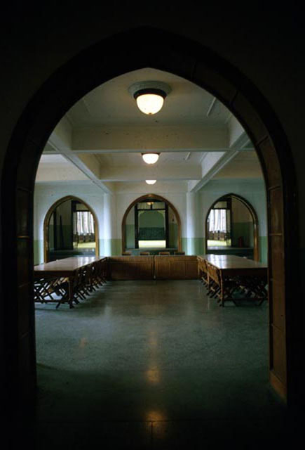 Interior view of meeting room, showing horseshoe arched entranceways