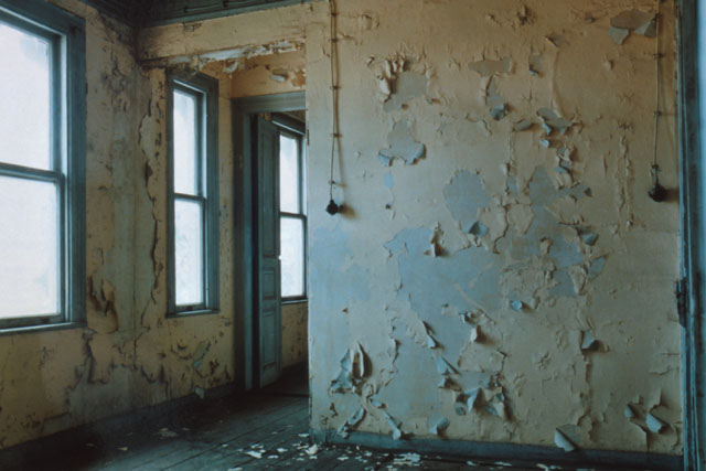 Interior detail showing dilapidated walls