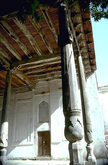 View of loggia in summer mosque showing wooden beams and columns supporting roof