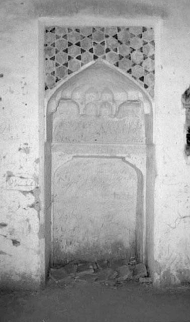 Interior detail view prior to the earthquake, showing the smaller mihrab niche with very simple muqarnas detailing and tile work framing the mihrab from above